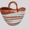 Handmade African woven basket bag with brown and white patterns and leather handles