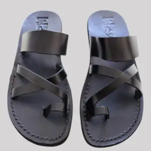 Black handcrafted leather sandals with braided strap design